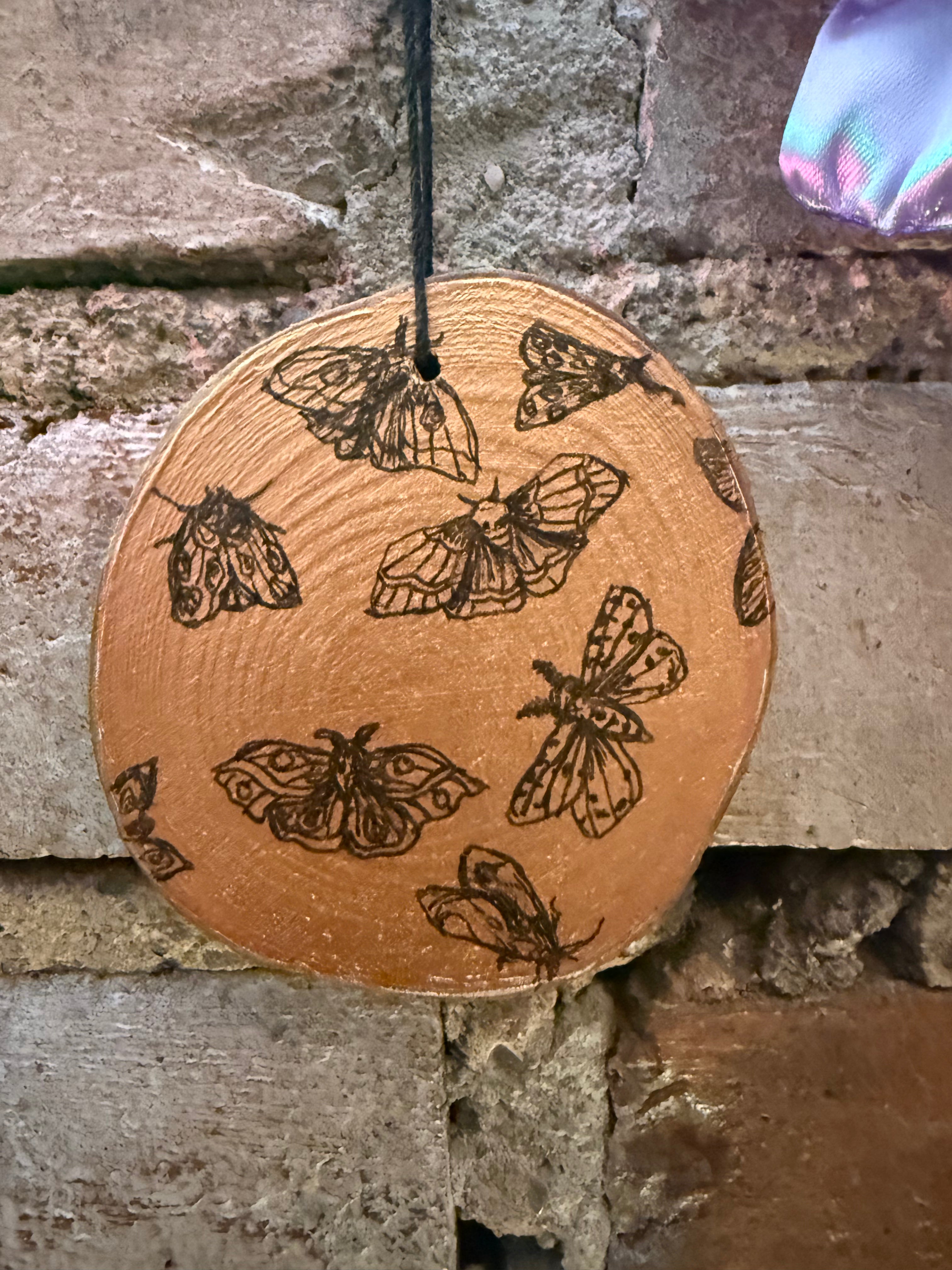 Round Wood Insect Artwork: Rachel Stottmann
